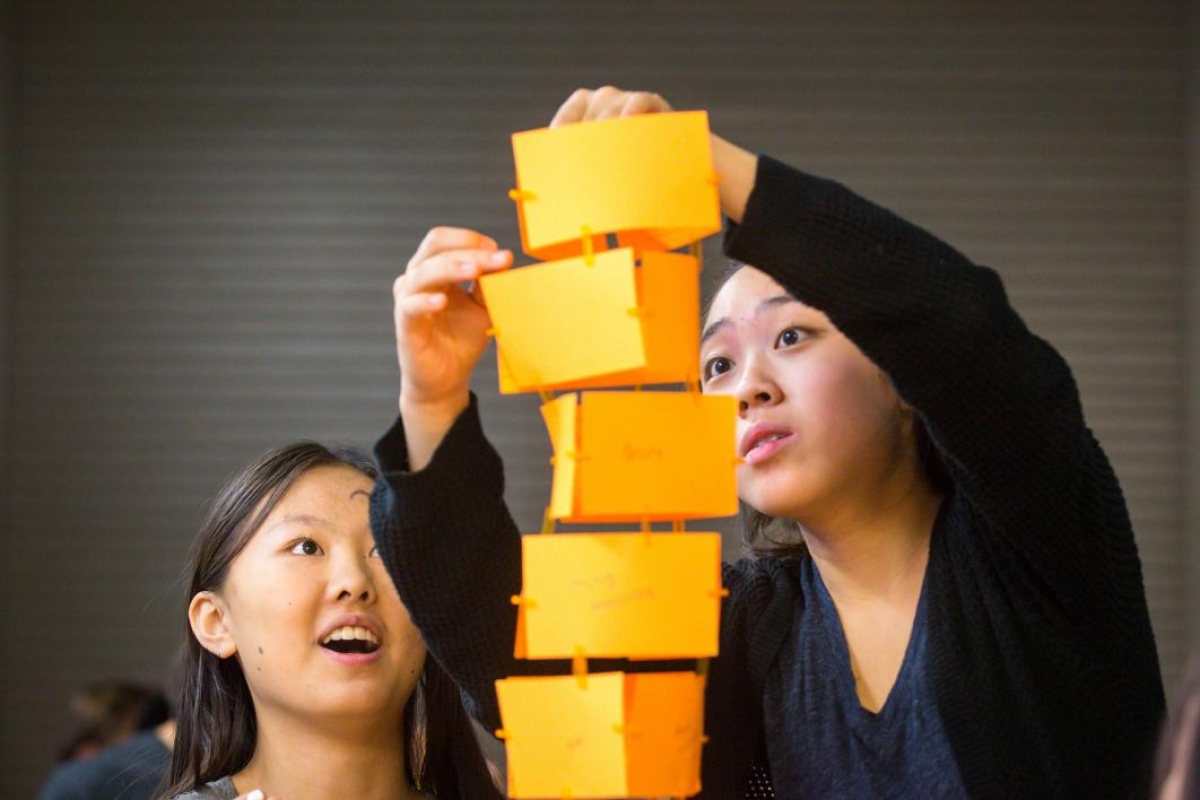 students building paper tower at summer camp