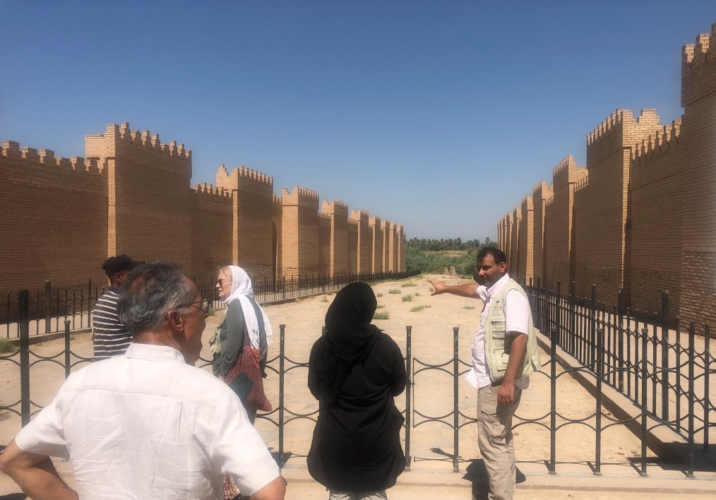 people looking at a historic site in Baghdad