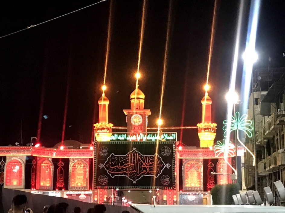 Pilgrims worship at the shrine of Hussain