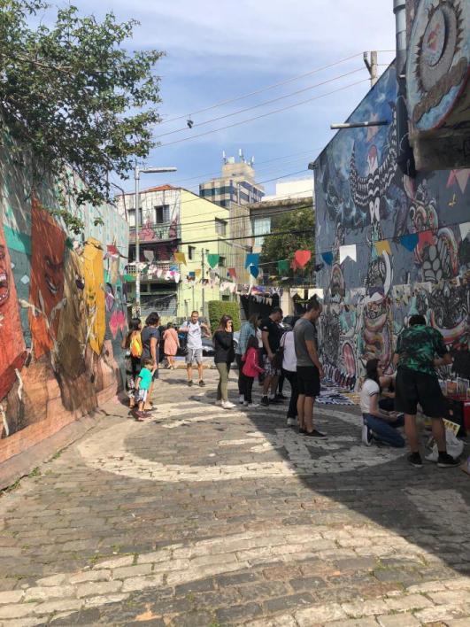 people working on a mural in Brazil