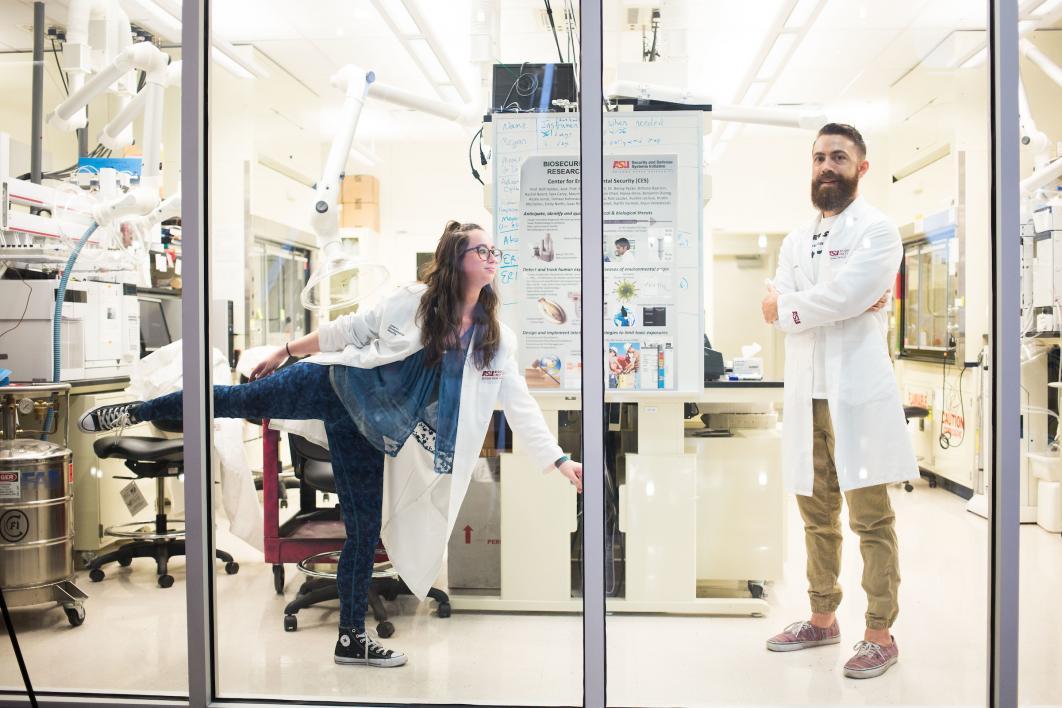 A portrait of a dancer and a scientist in a lab