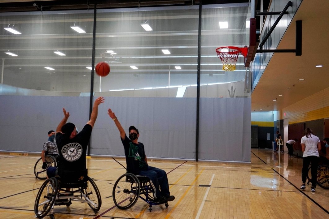 people playing basketball in wheelchairs
