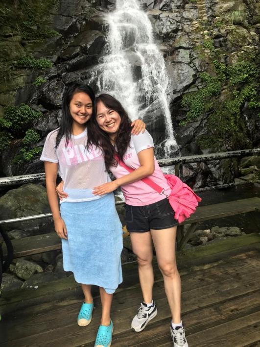 Mother daughter at waterfall
