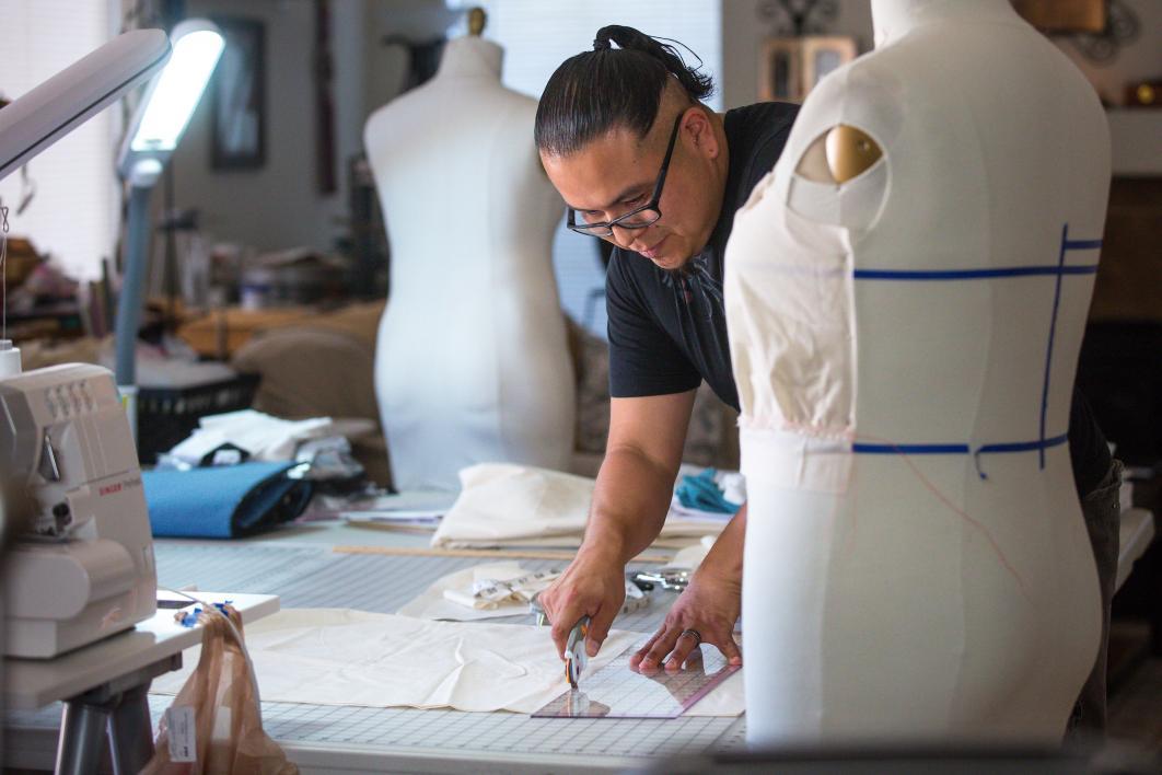 ASU alum and fashion designer Loren Aragon works at his home studio
