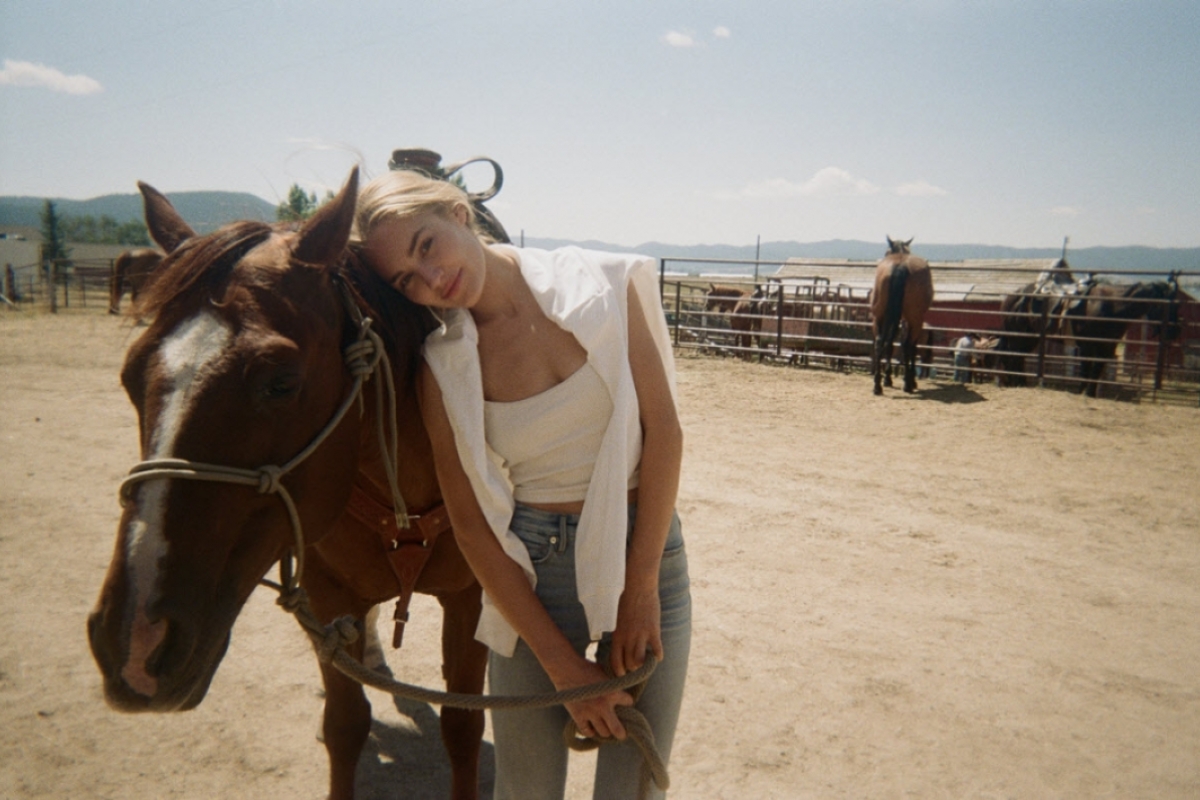 Michelle Randolph and a friendly horse pose on the set of "1923" in Montana. Photo courtesy Michelle Randolph.