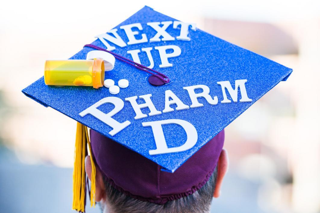 A graduation cap reads, 