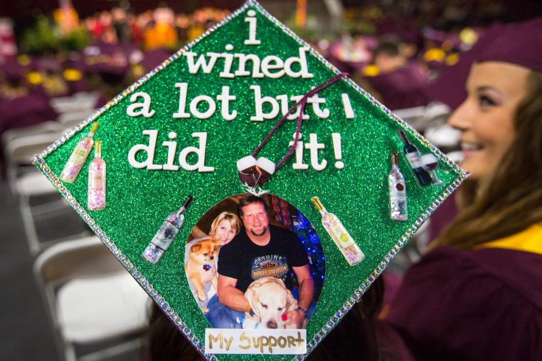 A graduation cap says, 
