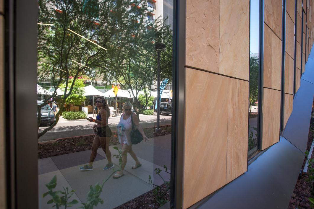 The move-in staging area is reflected in the new law building across the street.