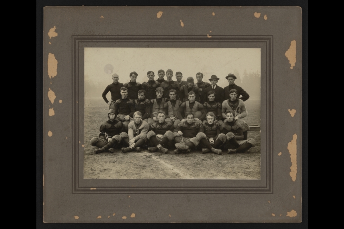 Black and white archival image of a football team photo