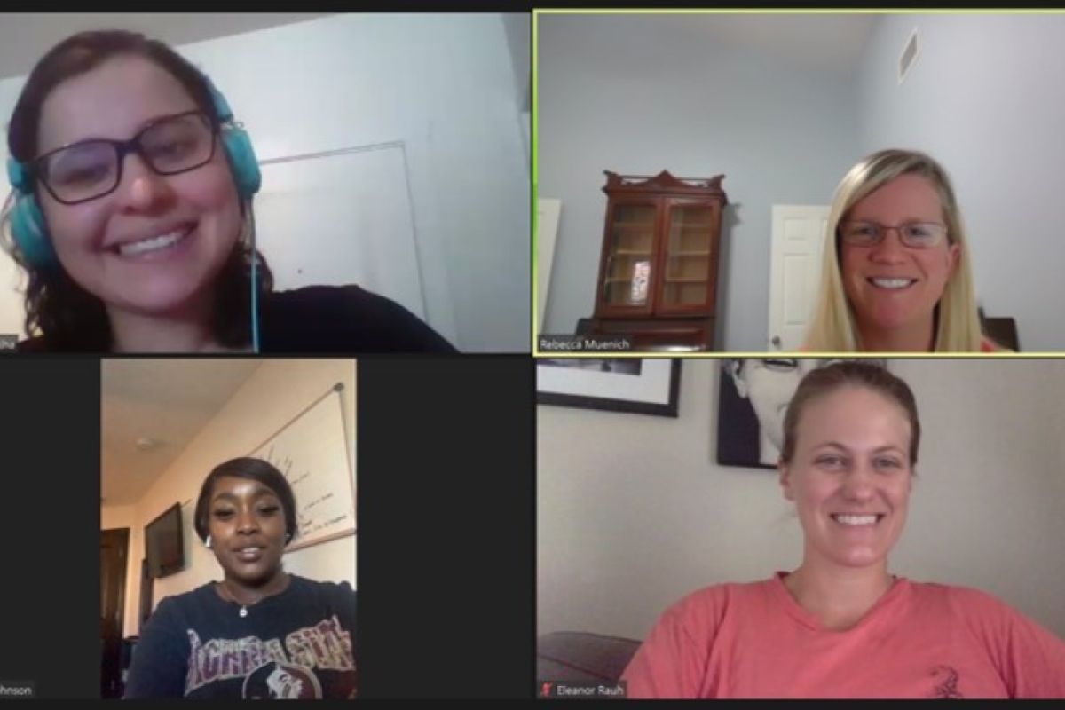 Screenshot of four people meeting on Zoom.