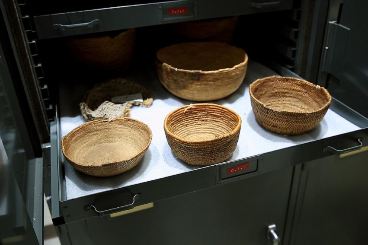 Ancient Native American baskets in a storage drawer