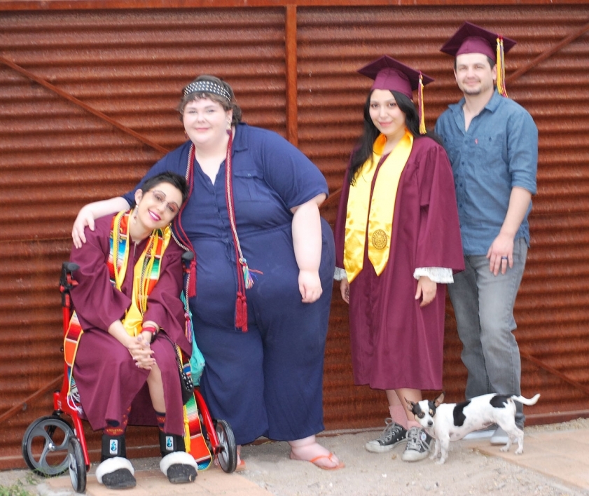 Nicole Haikalis, Sarah Davis, Analisa Benites and Lydan McLaws pose for a graduation photo.