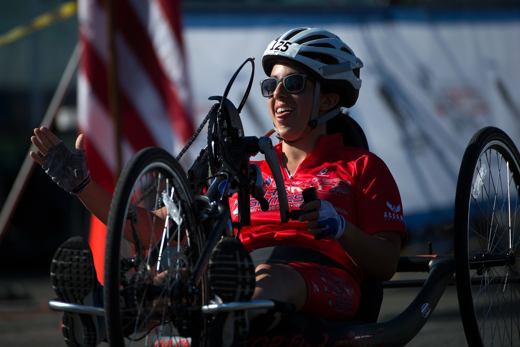 A photo of Nicole Haikalis riding a hand cycle in the 2016 Warrior Games.