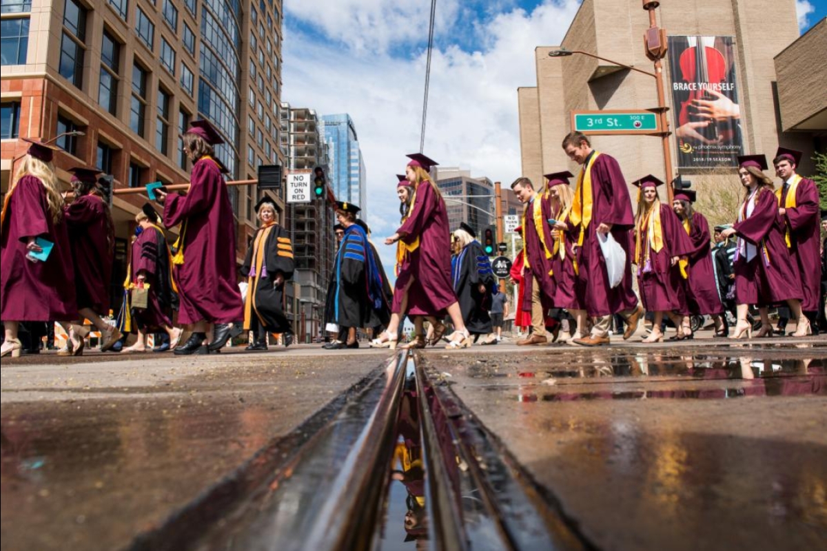 view up at graduates as they walk through downtown Phoenix