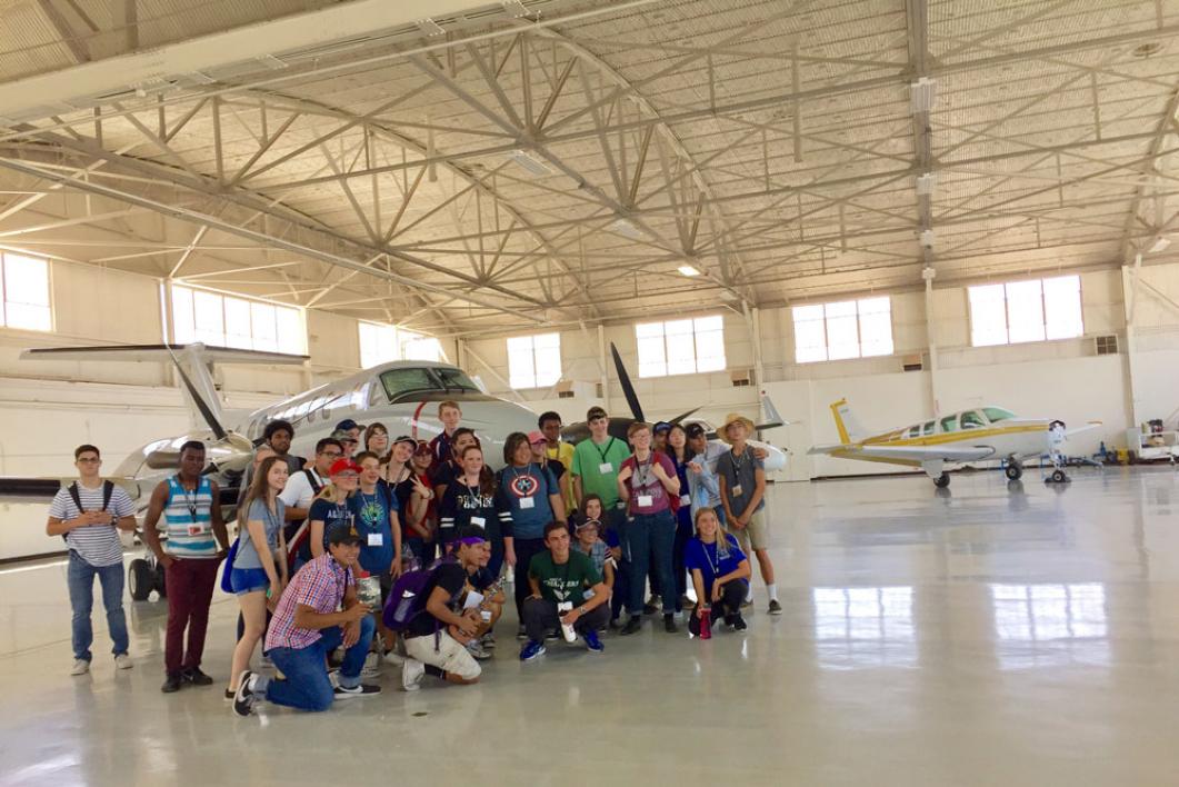 National Summer Transportation Institute students visited the hangars and tarmac at Gateway Airport in Mesa in one of several field trips to meet professional engineers at their workplaces. Photographer: Jessica Hochreiter/ASU