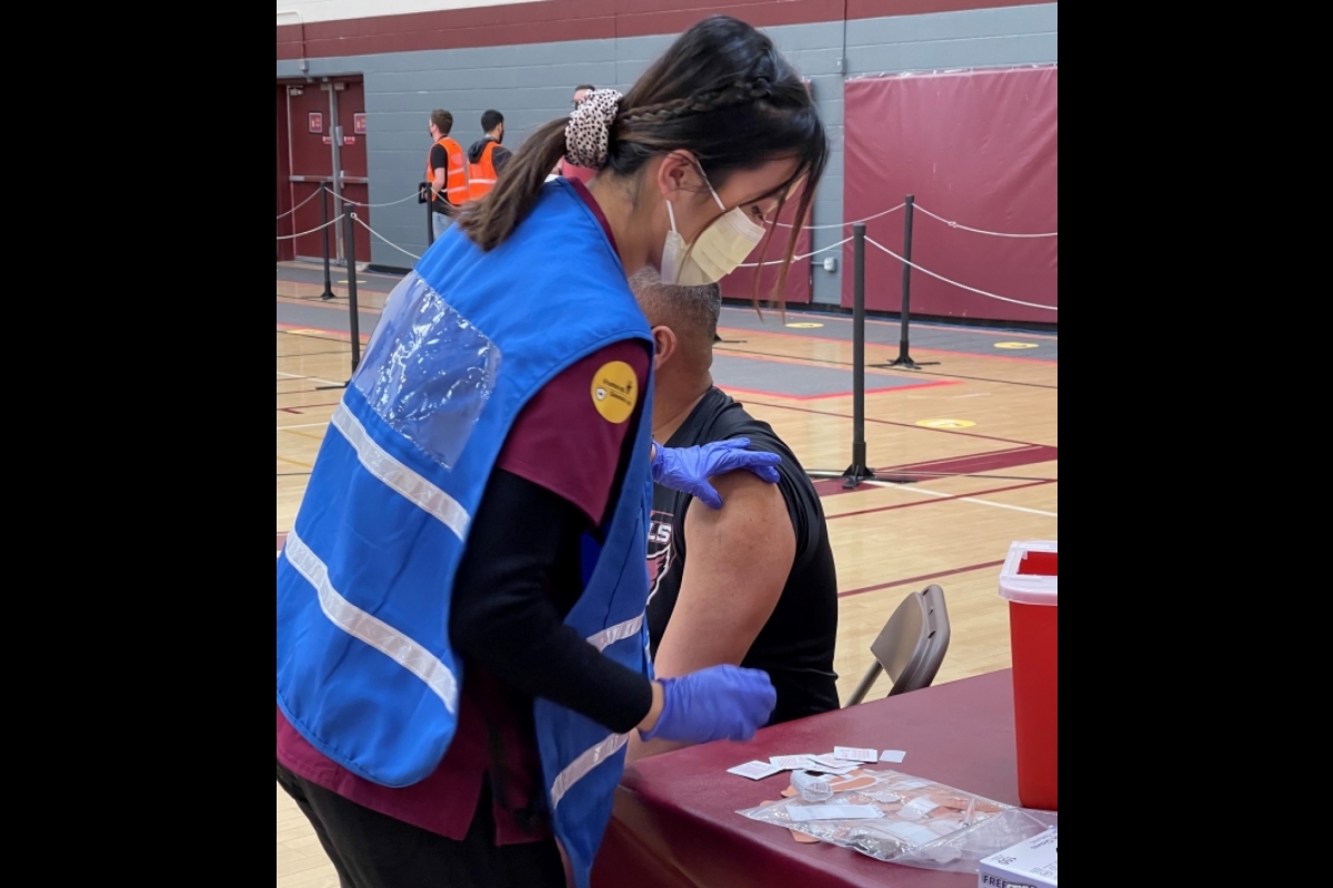 Edson College nursing student prepares to give a COVID-19 injection at an ASU vaccine clinic