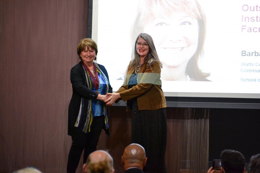 Barbara Klimek accepting her award from Tamara Underiner
