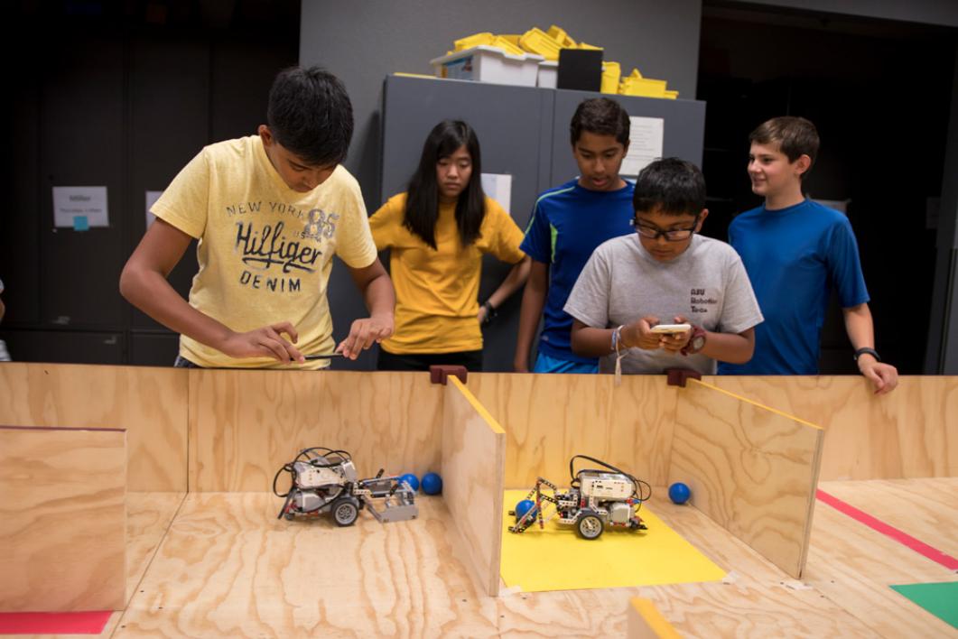 At 7UP Robotics Camp 7th and 8th grade students design and construct robots, learn EV3 robotics programming and participate in a robotics challenge similar to the FIRST® LEGO® League (FLL) Robotics Competition. Photographer: Marco-Alexis Chaira/ASU