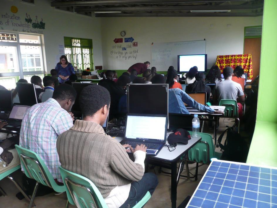 Students in Rwanda use computers in a classroom