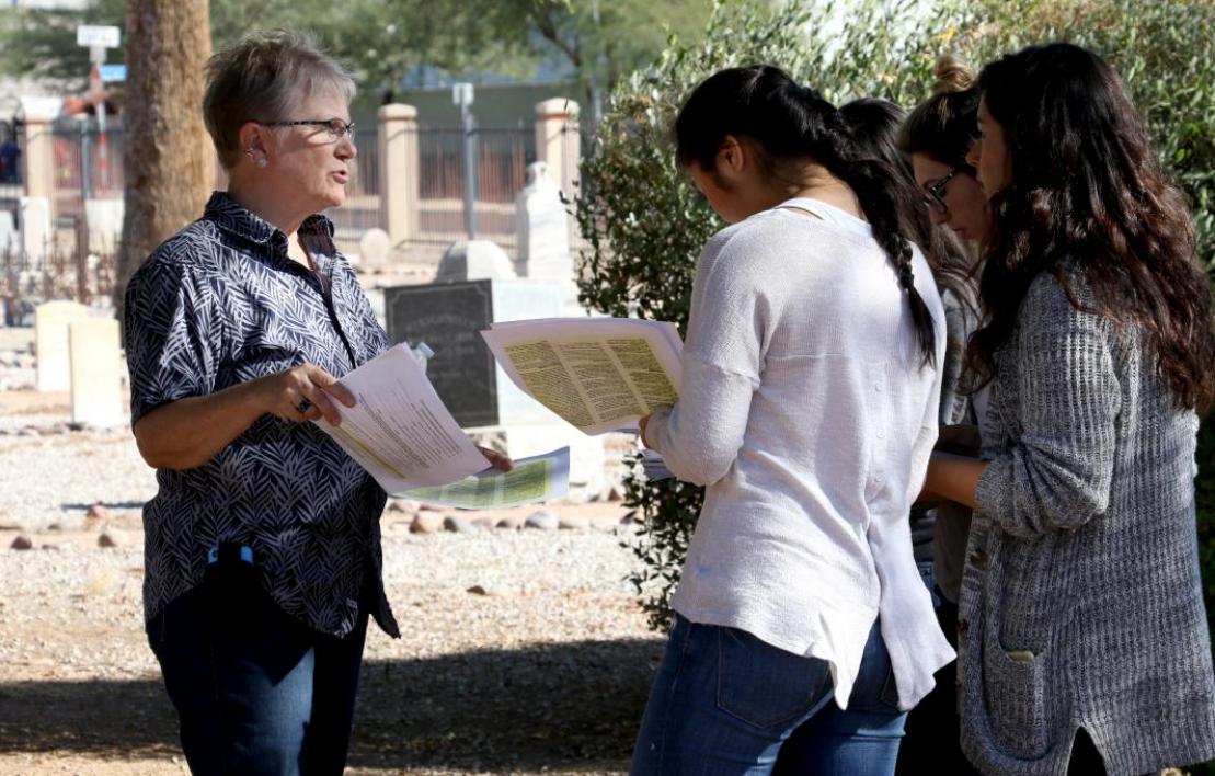 ASU historian Pamela Stewart with students at Phoenix cemetery