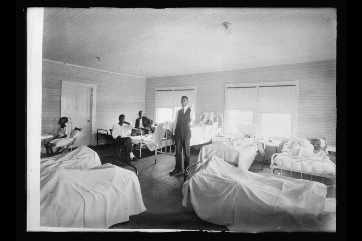 historical photo of patients recovering in a medical room