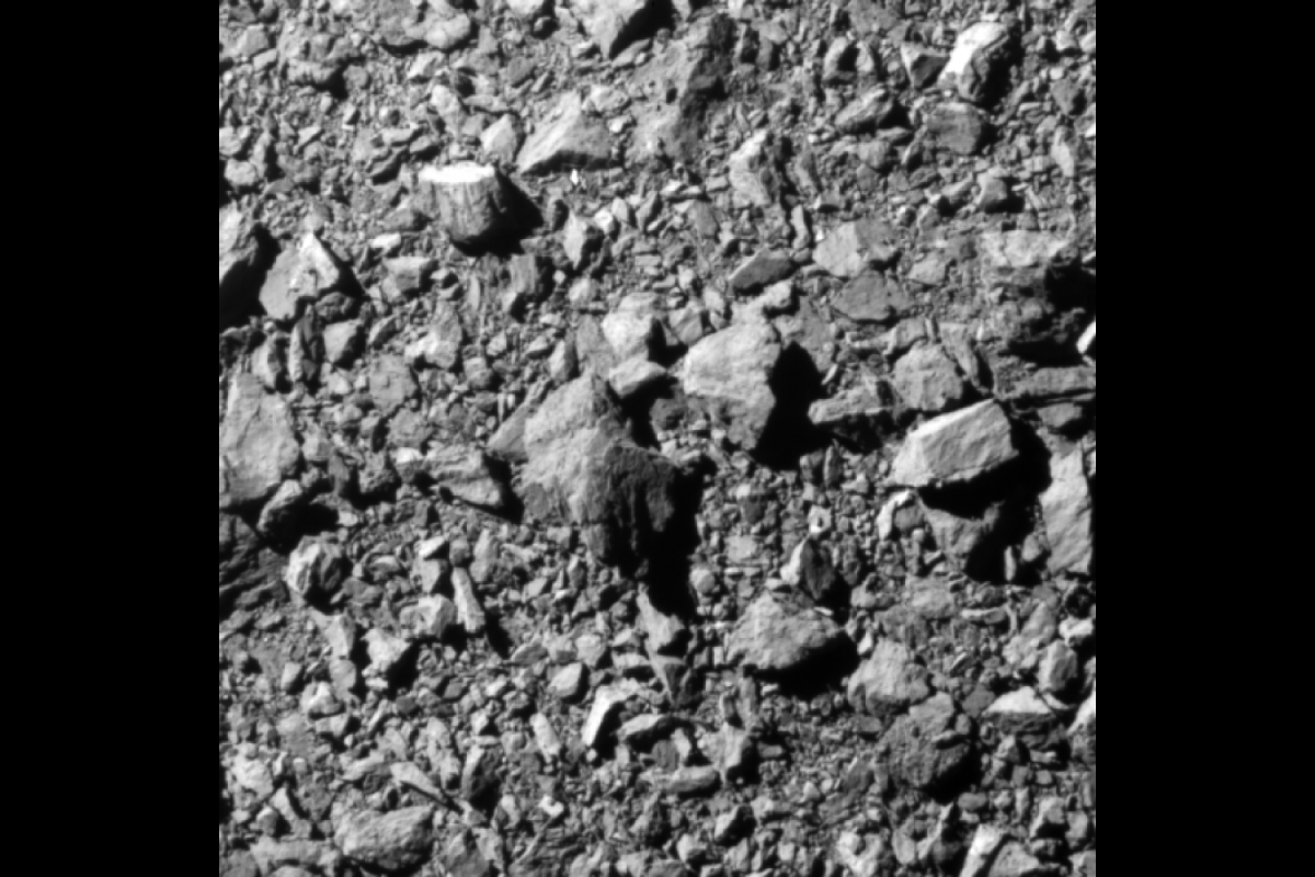 Close-up view of the rocky surface of an asteroid.