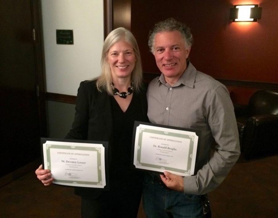 English faculty Devoney Looser and Ron Broglio pose with “Mentor Champion” award certificates / Photo by Eric Wertheimer