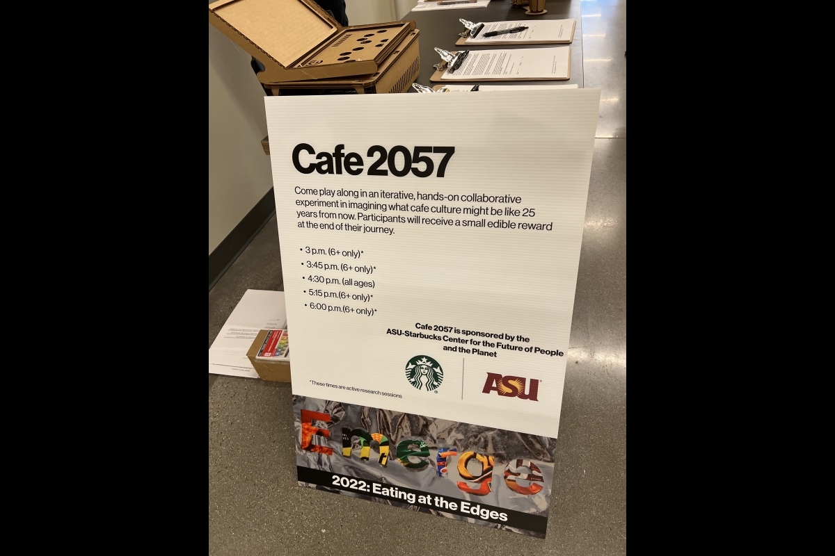 Sign with admission times for Cafe 2057