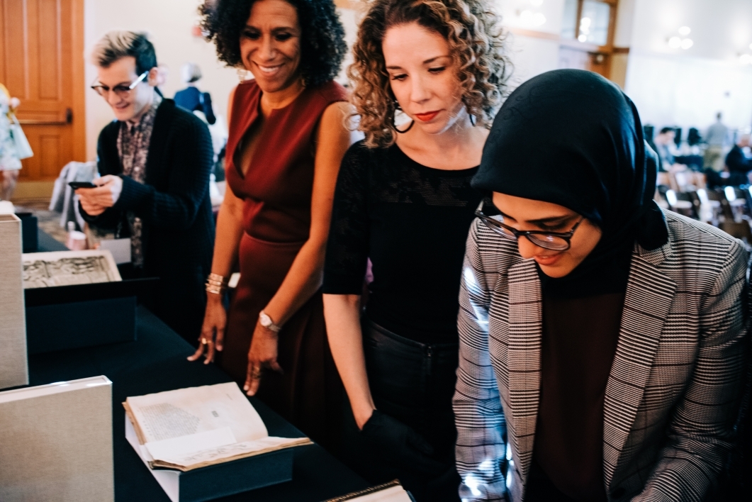 Scholars gather to look at ASU Library's display of medieval manuscripts during RaceB4Race in January 2019
