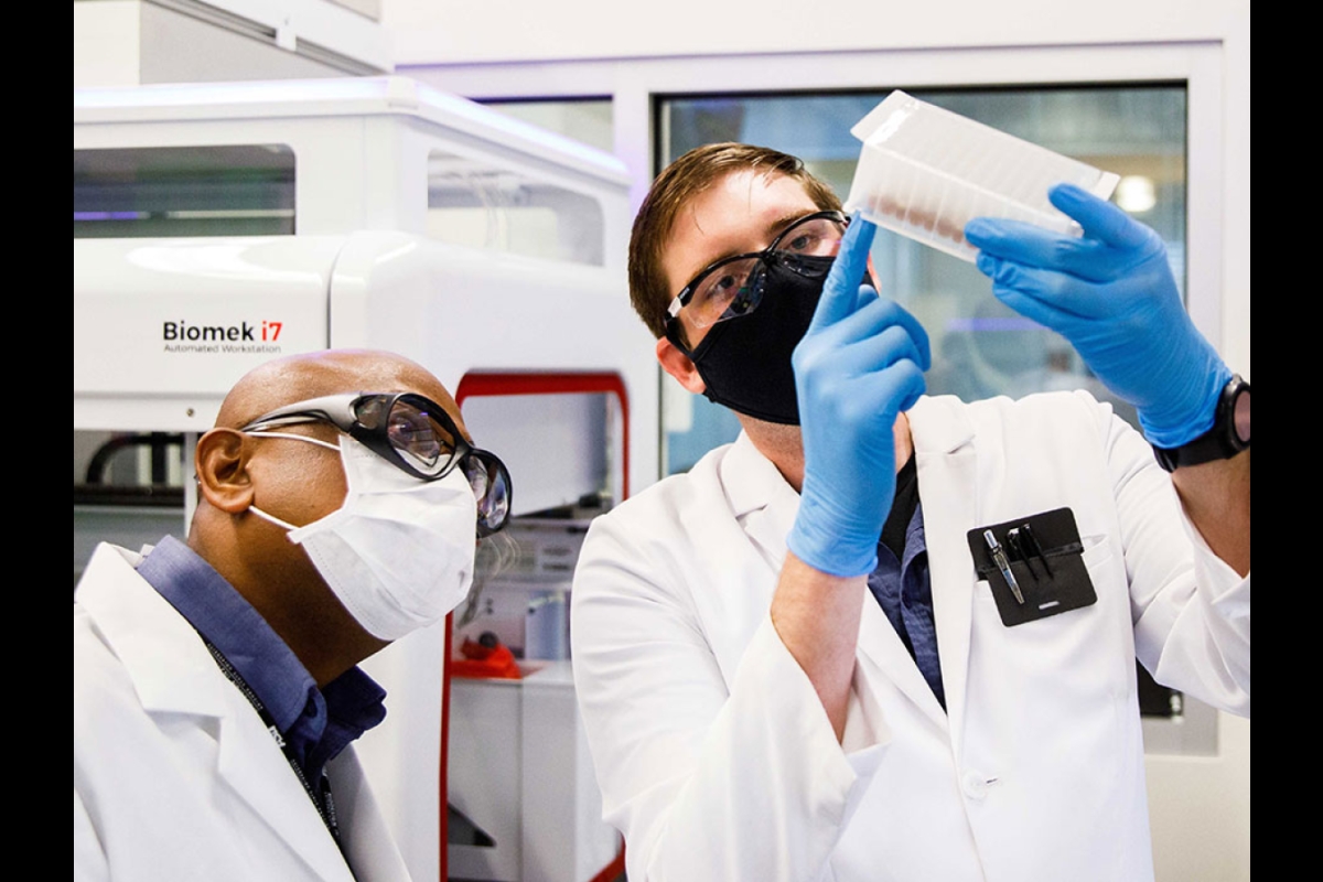 men looking at samples in lab