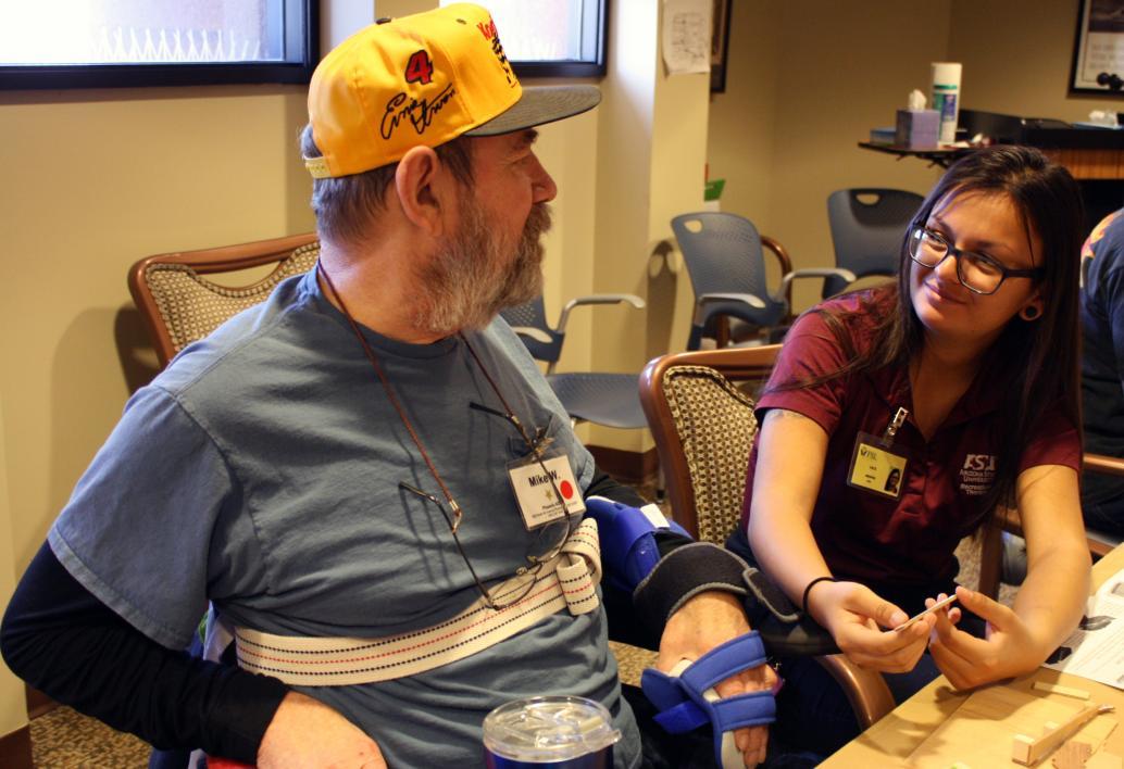 Therapeutic Recreation student chats with member of Veterans' group