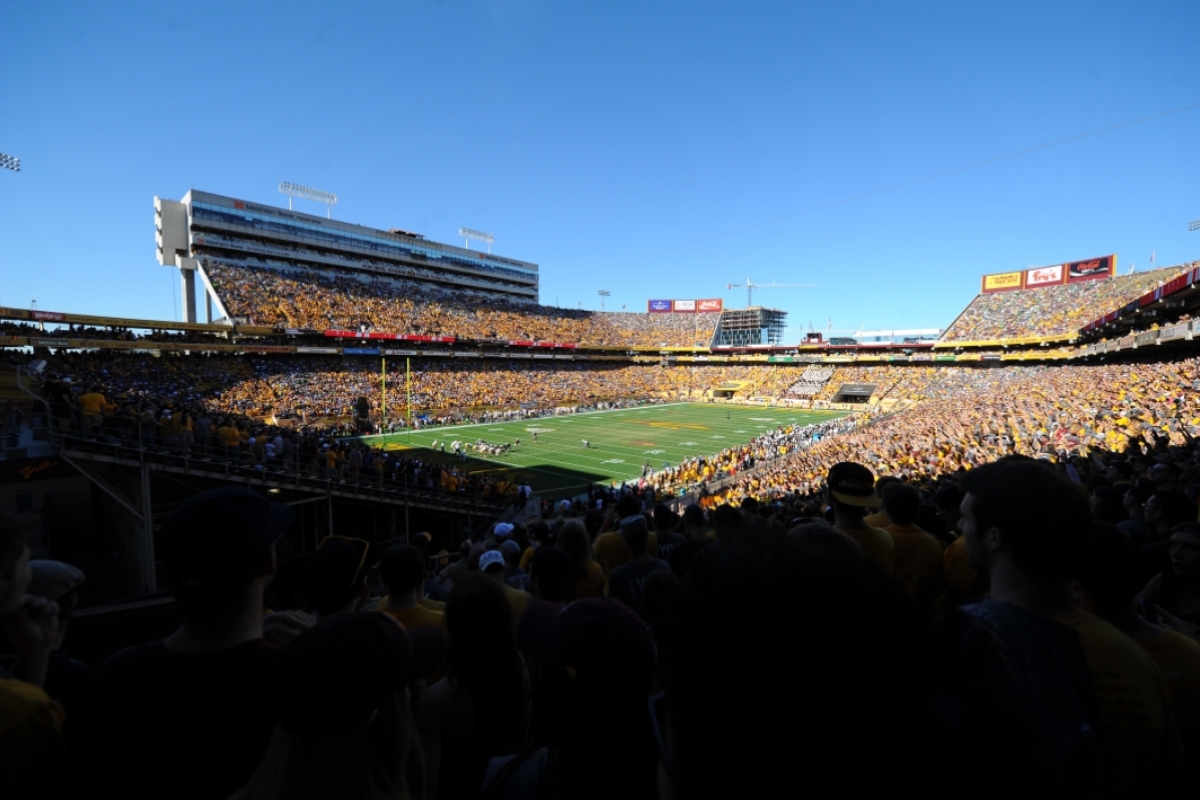 ASU football stadium filled with fans during 2014 with part of the stadium under construction