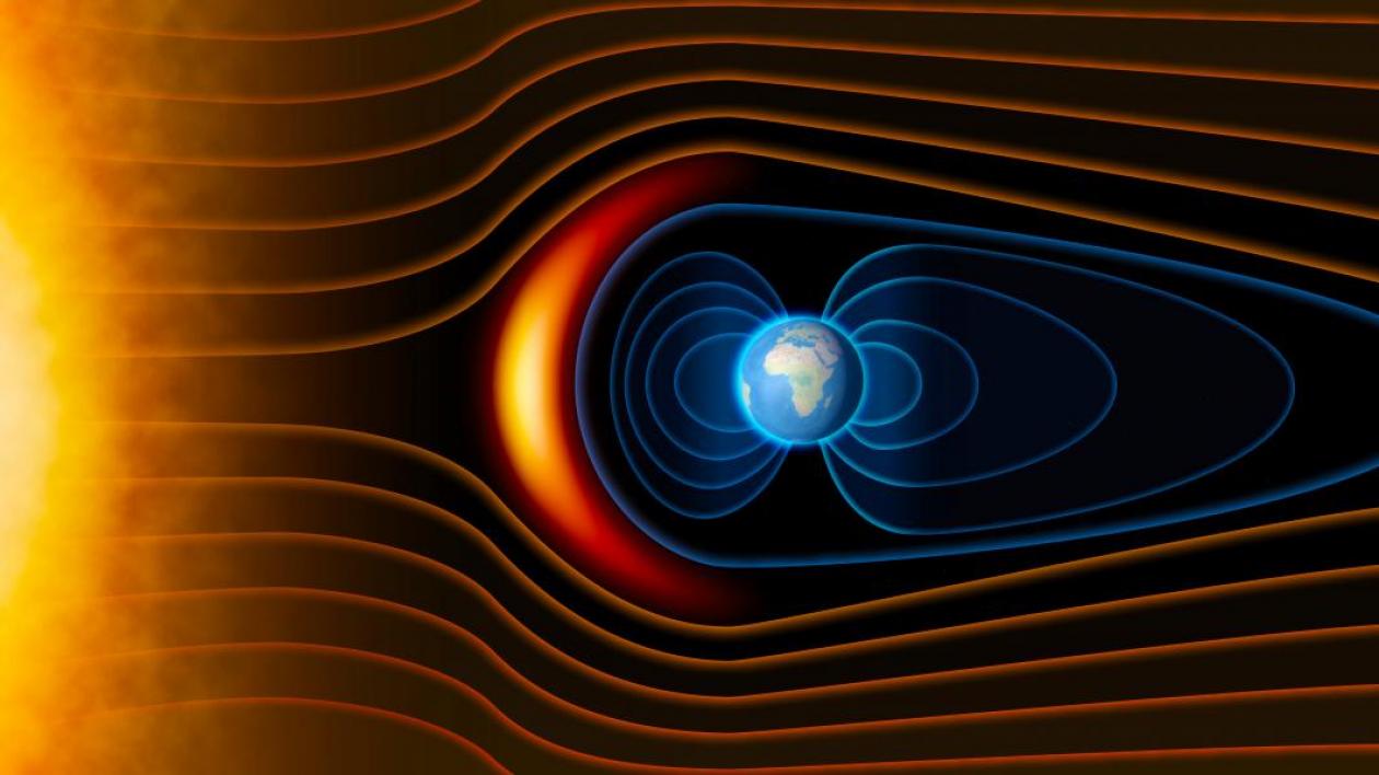 A graphic of the earth showing radiation belts protecting the earth from the sun.