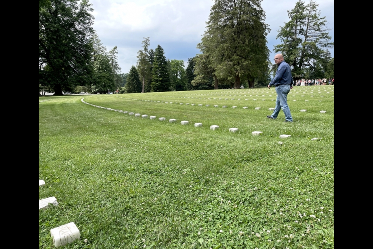 Brooks Simpson walks along the rows in the Gettysburg National Cemetery.