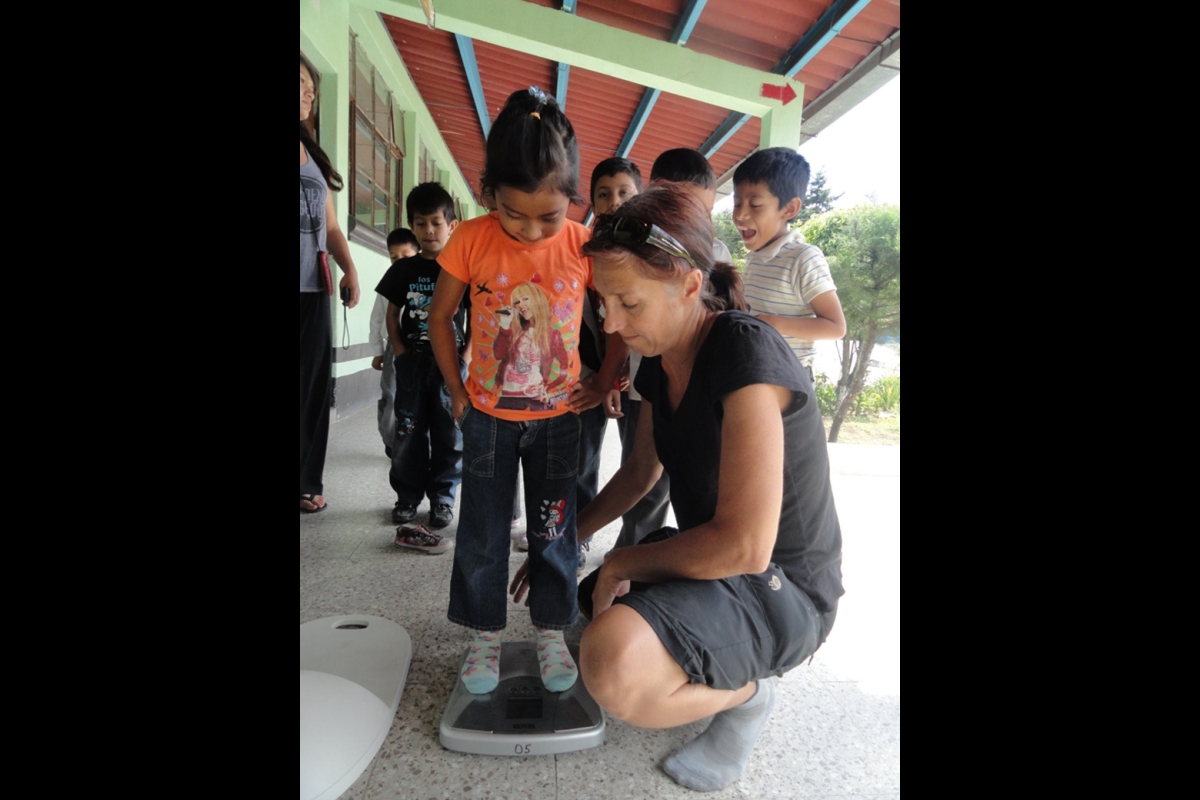 Guatemalan students are weighed as part of an ASU research project.
