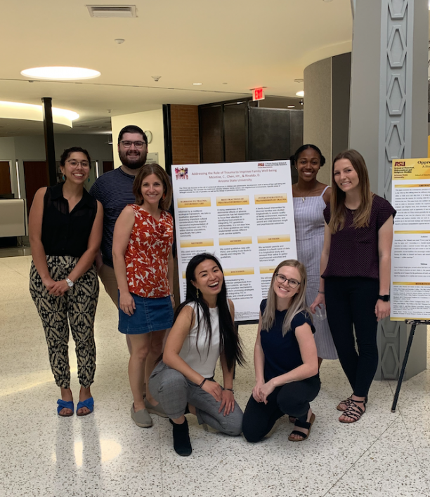 Sofia Chen in front of her research poster with 5 fellow students and one faculty member