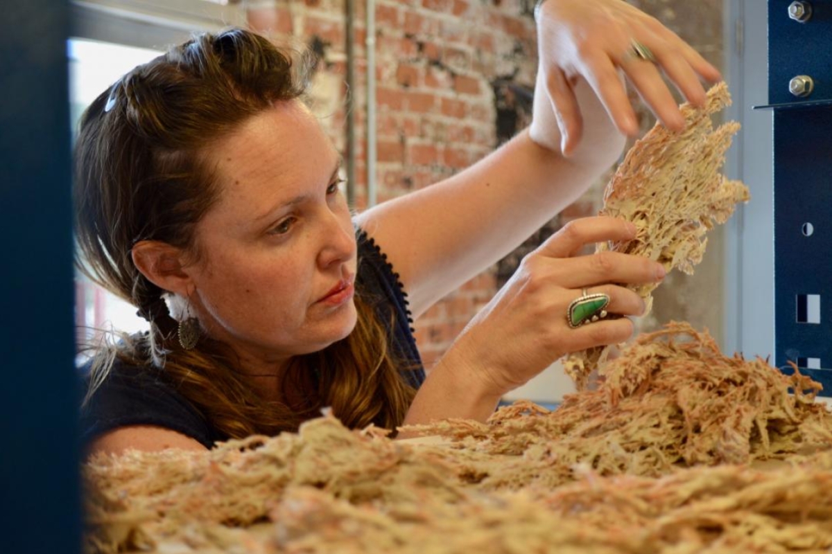 ASU graduate student Brandi Lee Cooper prepares a ceramic piece for Sculpting Science