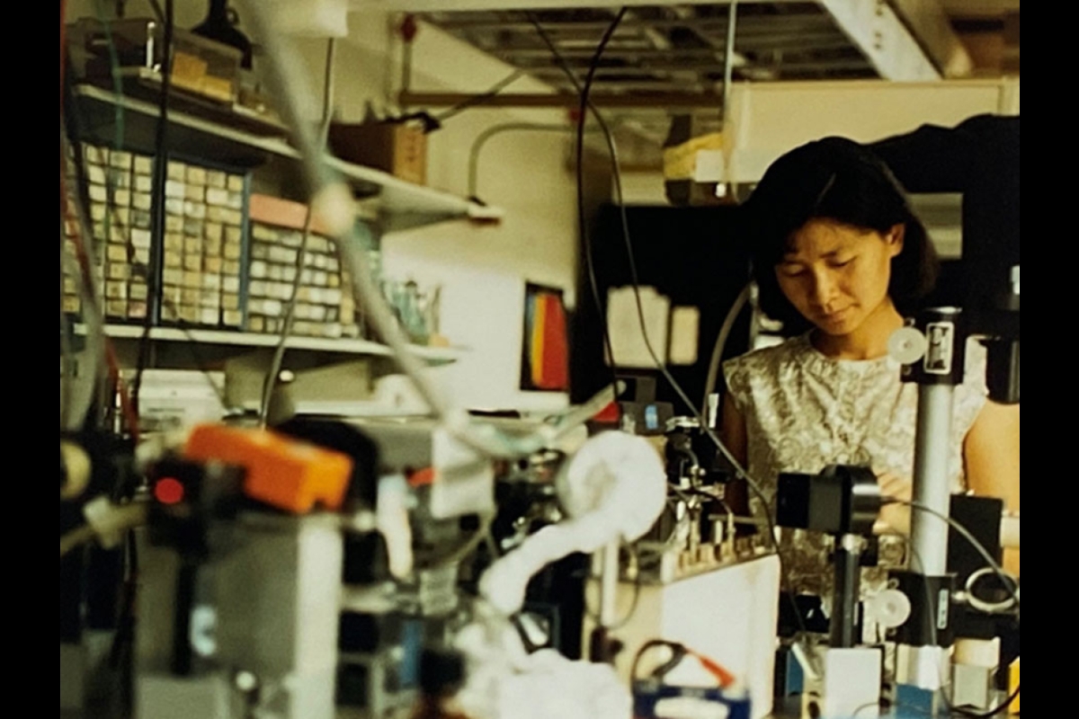 Woman working in laser facility