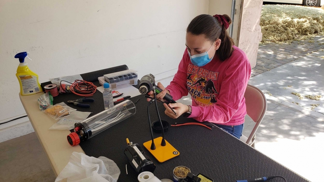 Laura Roty of the mechanical team assembling battery pod 1.