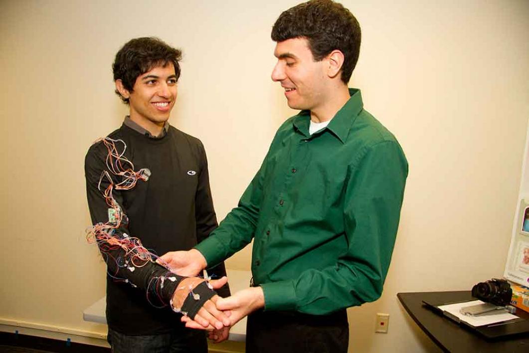 Troy McDaniel (right) develops wearable cyber-physical systems for stroke rehabilitation with undergraduate student Bijan Fakhri.