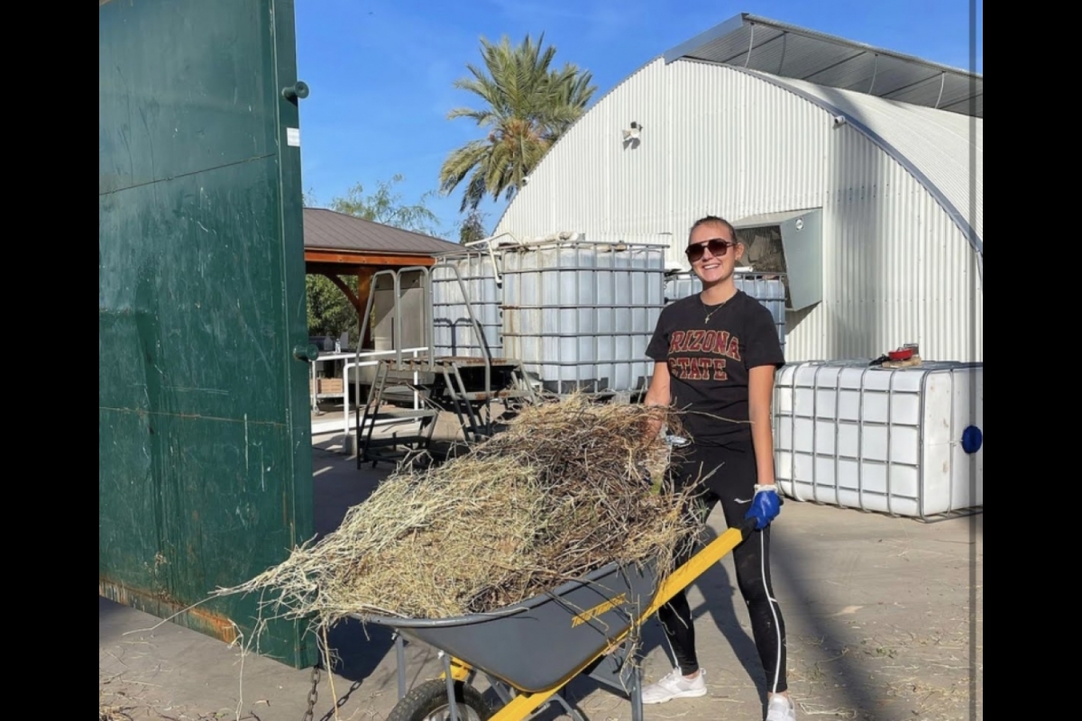 Brianna Stinsman volunteering with the NGSC at the IRC Phoenix Community Garden