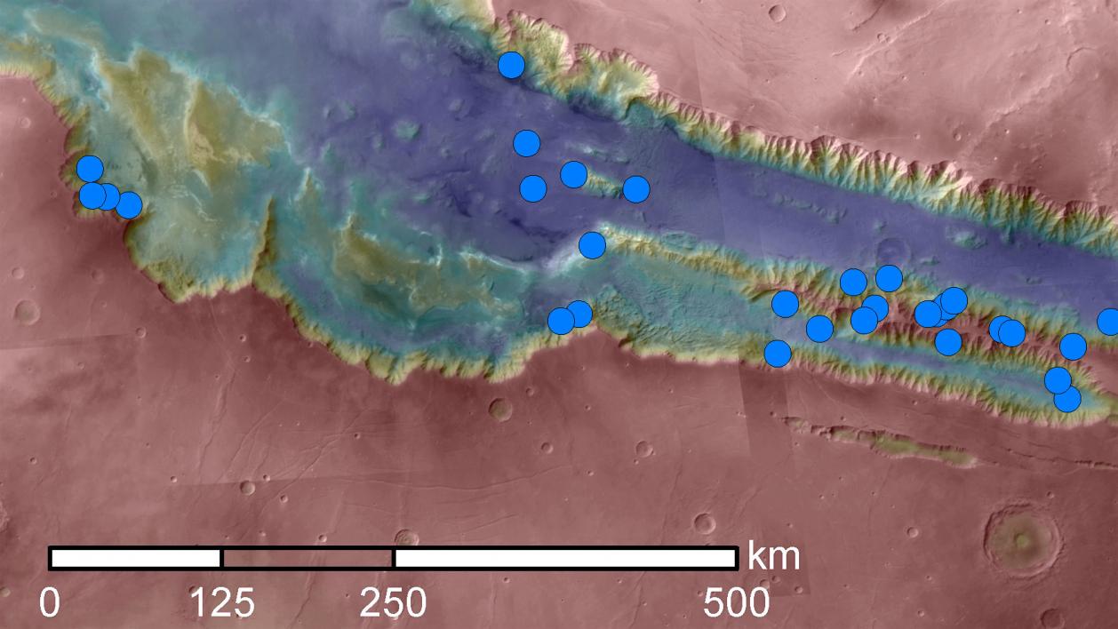 Blue dots mark seasonal dark streak sites in Valles Marineris on Mars