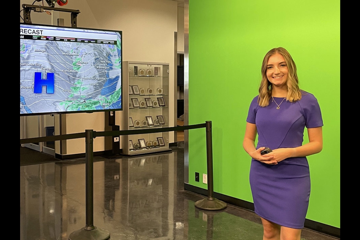 Student presenting the weather on news