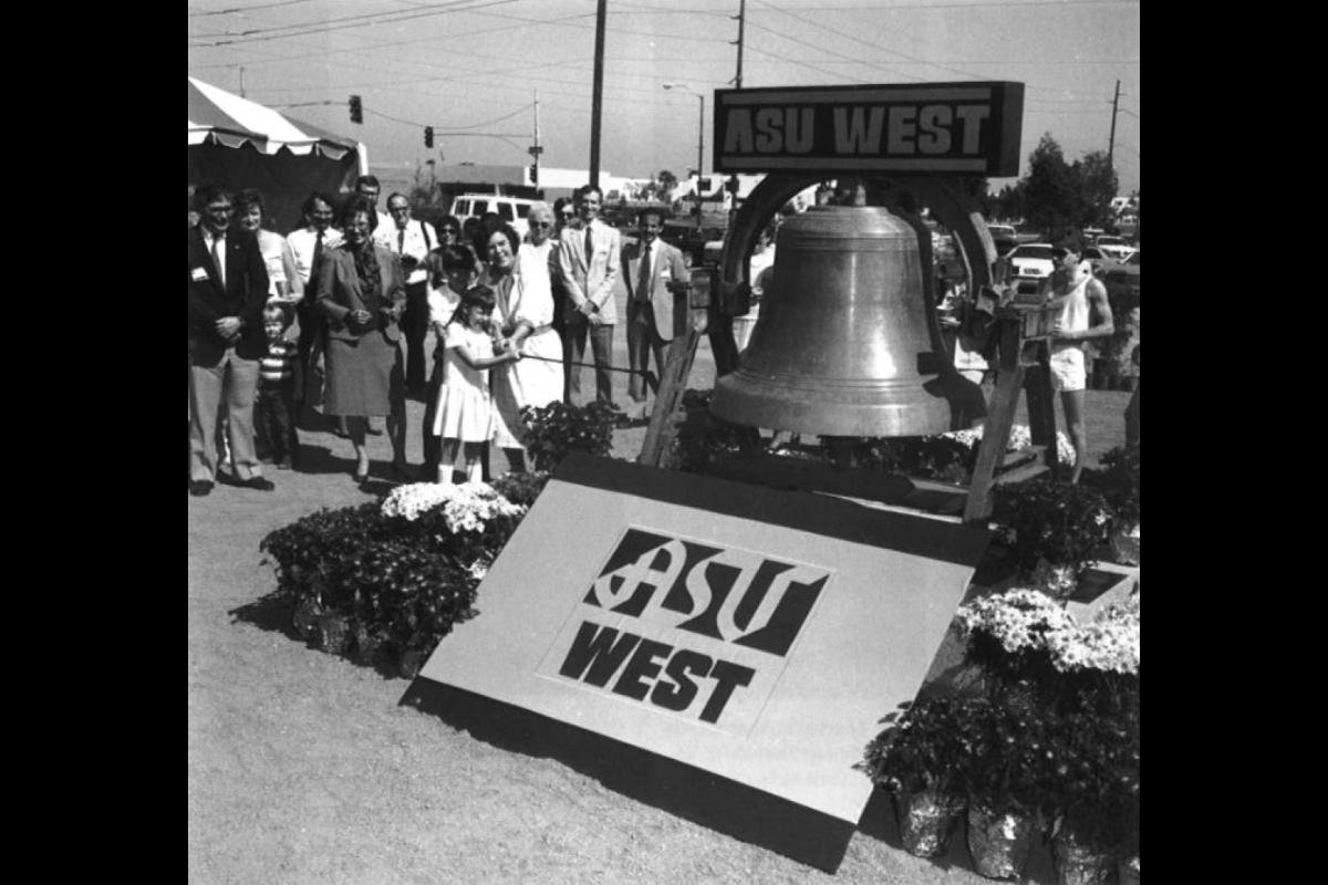 crowd gathered around large bell