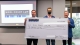 Connor N. Hubach and Michael Hool present a check for $10,000 to Zachary Holman at the ASU Hool Coury Law Tech Venture Showcase.