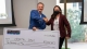 Michael Hool presents a $10,000 check to Mariana Bertoni at the ASU Hool Coury Law Tech Venture Showcase.
