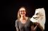 Sarah Lankenau Moench, assistant professor of costume technology, poses with a student-made mask in the Hayden Library maker studio.