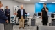 WearTech Applied Research Center Operations Director Wes Gullett (left) introduces Hoolest Performance Technologies to guests at a grand opening in September 2019 as Nick Hool demonstrates the technology. 