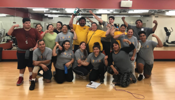 Participants in a study aimed at Latino children predisposed to diabetes pose for a group photo after a physical fitness class at the YMCA