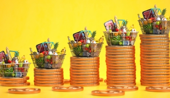 Illustration showing grocery baskets of food on top of increasingly taller piles of coins
